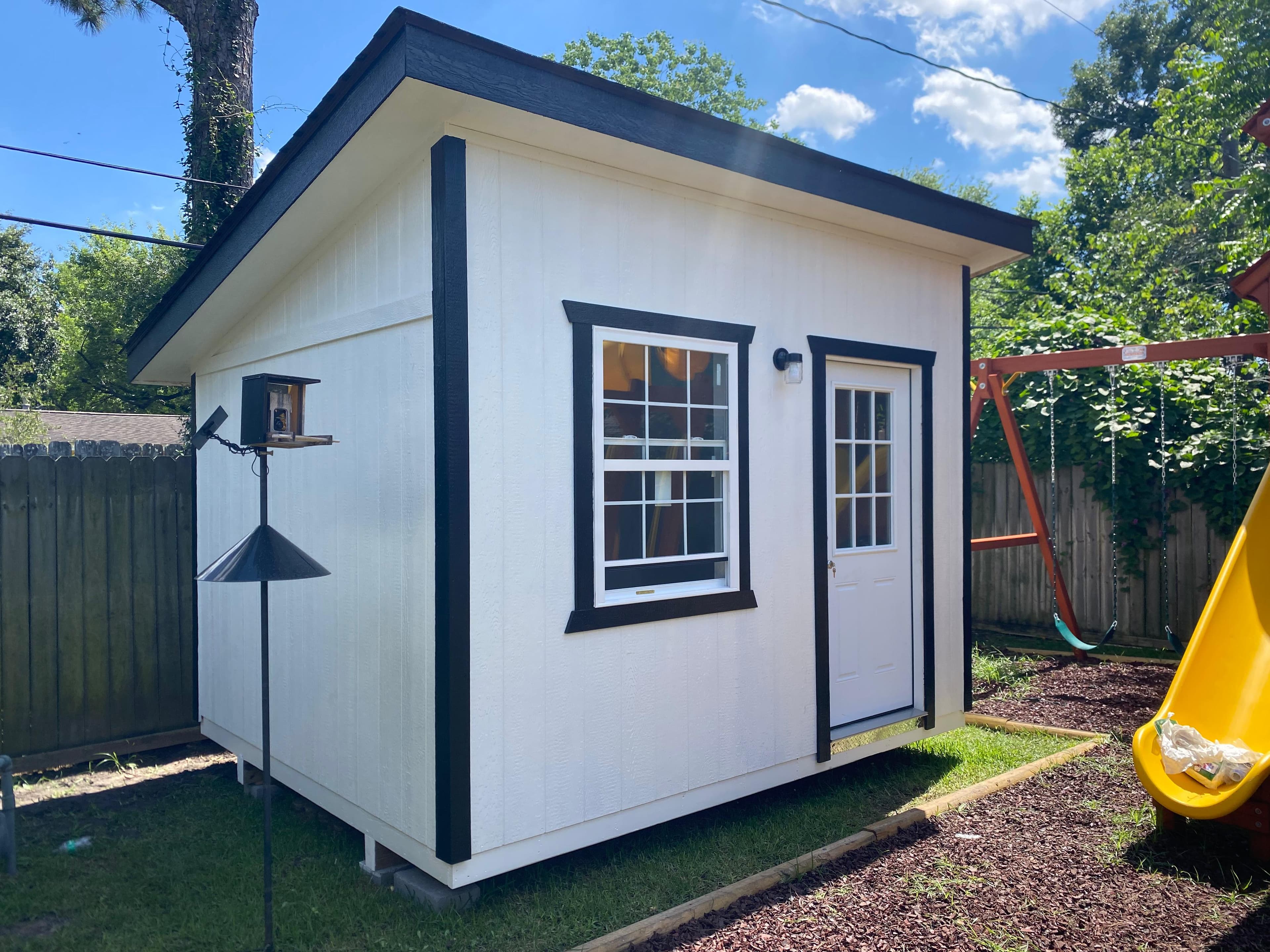 Real white and black Johnny's Backyard storage shed