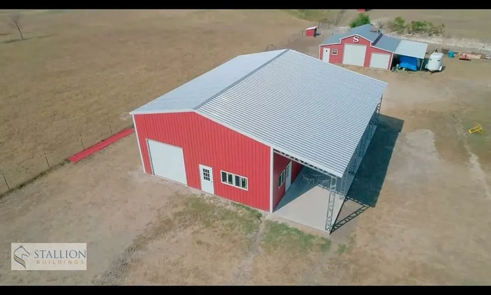 Completed red metal building viewed from above
