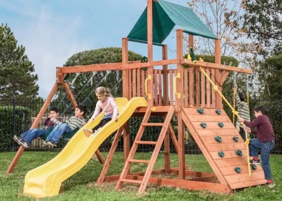 Tree Frogs Orangutan Fort Premium Cedar Wooden Swing Set with Green Tarp and Yellow Wave Slide